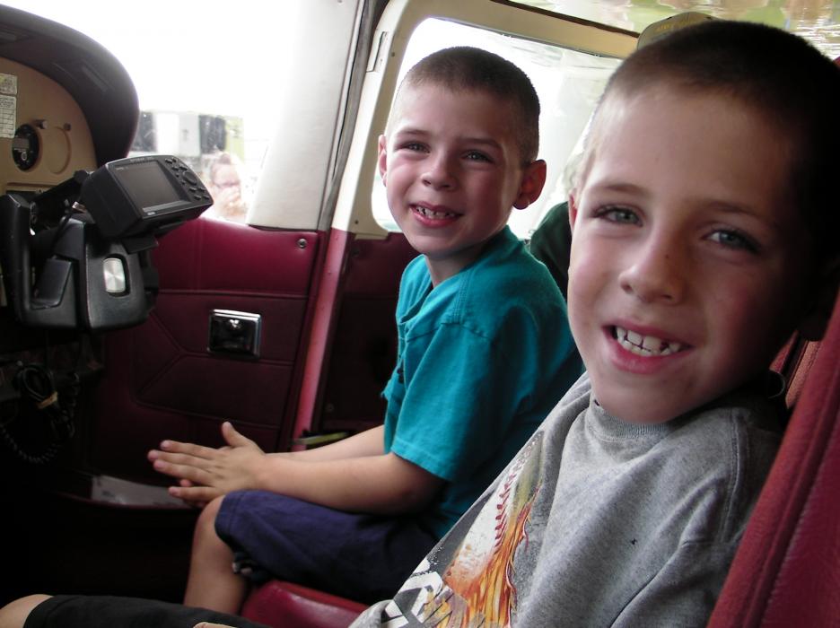 Twins Dakota and Easton Lott, ages 8, inside a search and rescue aircraft.