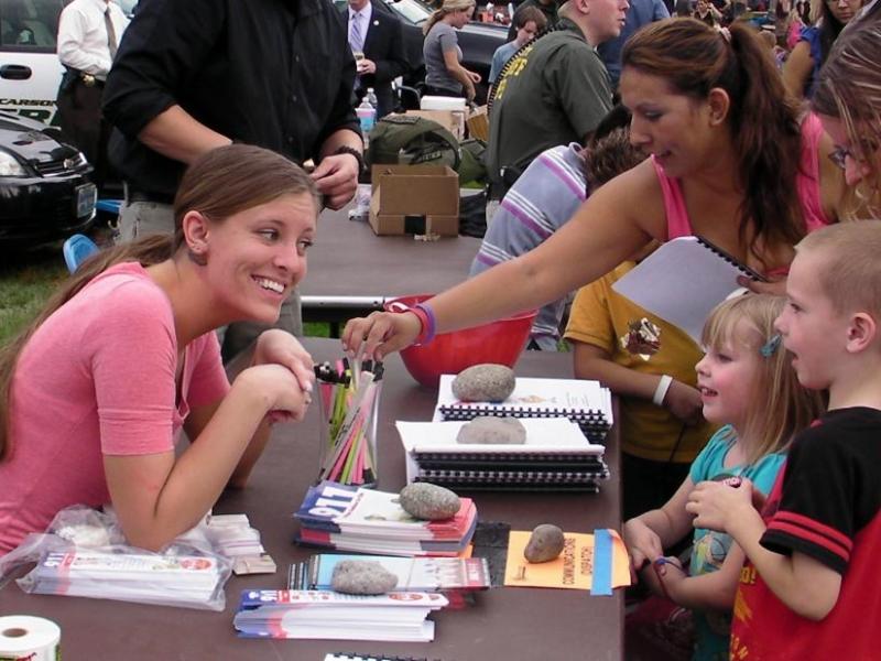 Carson City dispatcher Jen Davis speaks with children at Tuesday's event.