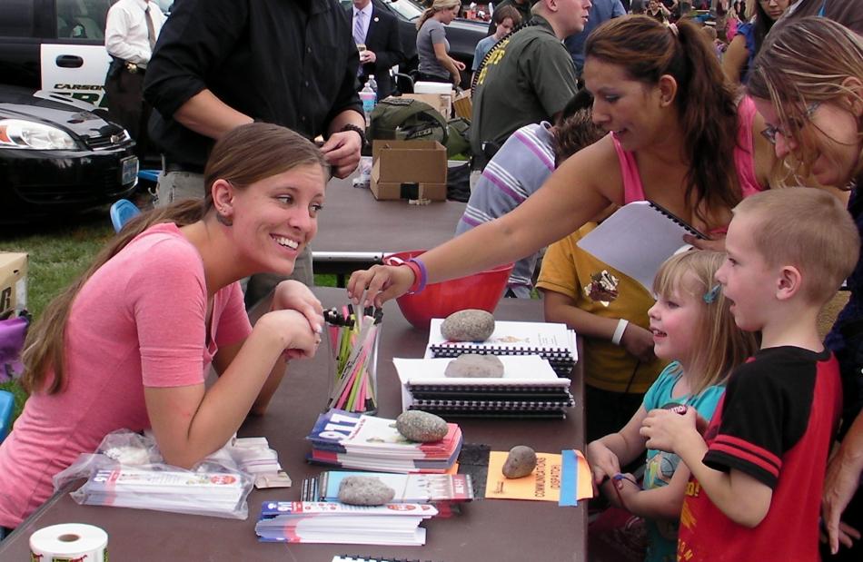 Carson City dispatcher Jen Davis speaks with children at Tuesday's event.