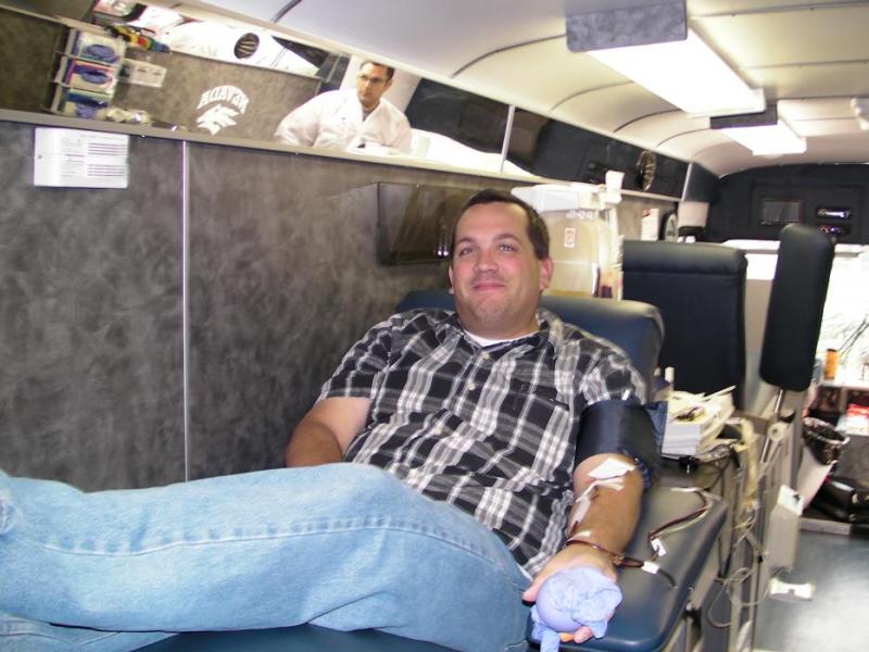 Scott Wilde of Greater Nevada Credit Union was the first to give blood Wednesday morning.
