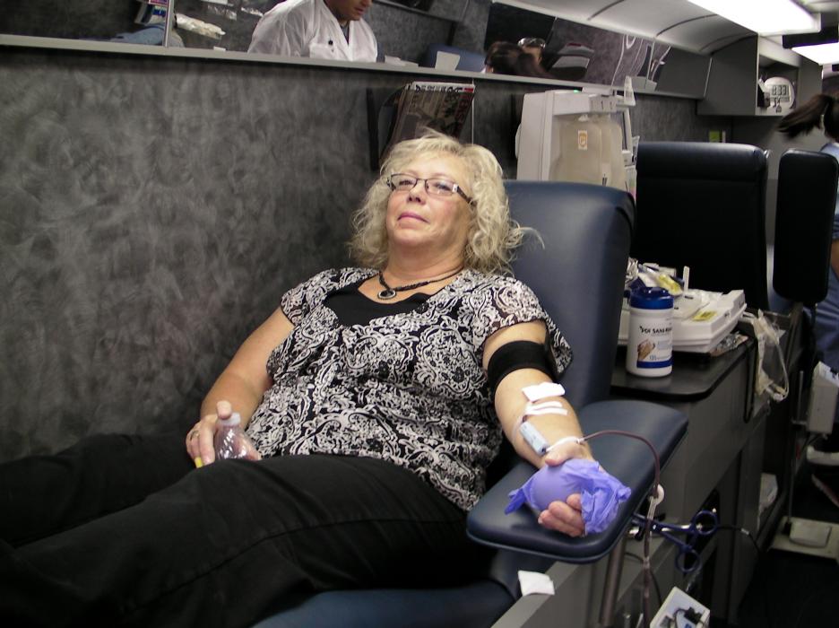 Lora Schueller of Stagecoach gives blood on Wednesday.