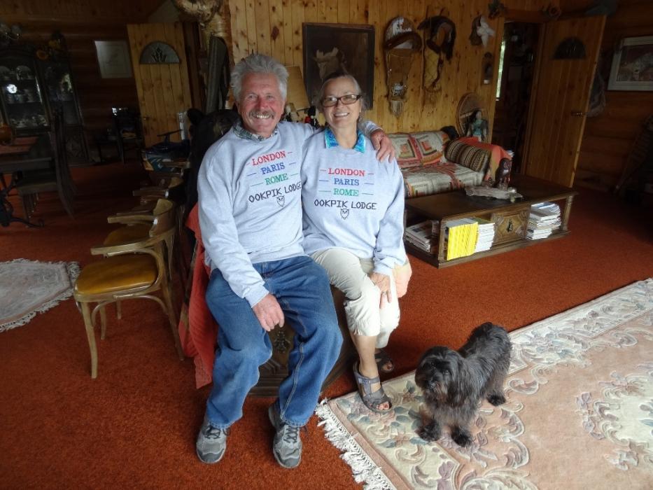 The hosts, Helmut and Caroll Hofmeister, pose with their dog, Cinder-Ella. Photo by Elaine Quilici