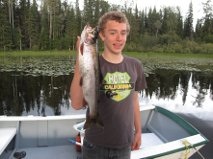 Jacob Bush, 15, of Vermilion, Alberta with a 20-inch rainbow caught at Babine Lake in British Columbia. Photo by Mike Bush