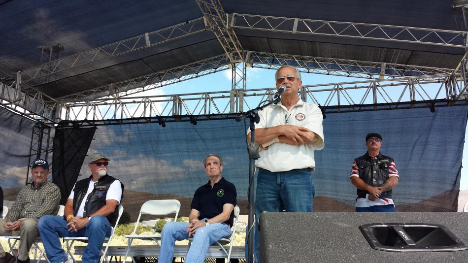 Perry Di Loreto addresses motorcyclists at the 9/11 event.