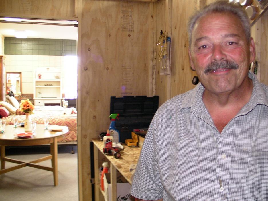 Kelly Nolan inside one of his shops where he refurbishes used furniture.