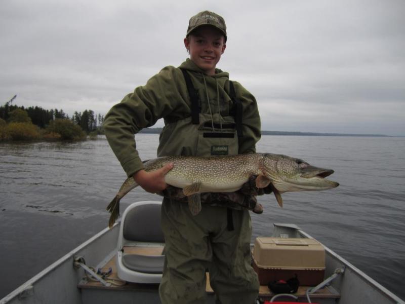 Dawson Fettic, age 14, of Carson City with a 20-pound, 44-inch Northern Pike caught in Canada. Photo by Mike Fettic