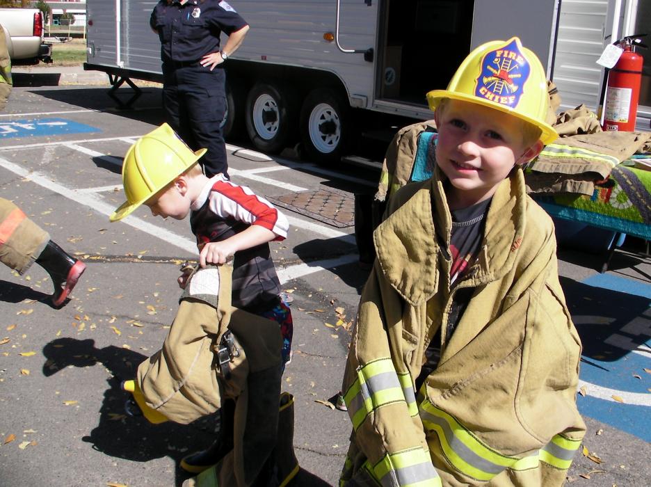 Carter Mason, 3, suits up with brother Ryan Mason, 5.
