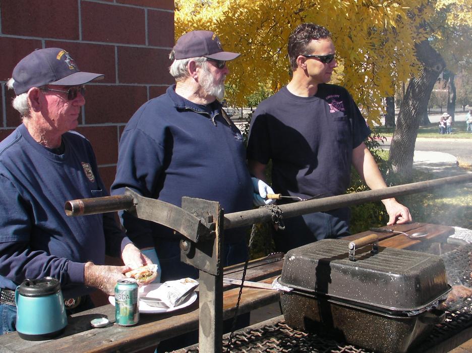 Pat Hill, Paul Webster and Bryon Hunt grill up burgers at the fundraiser.