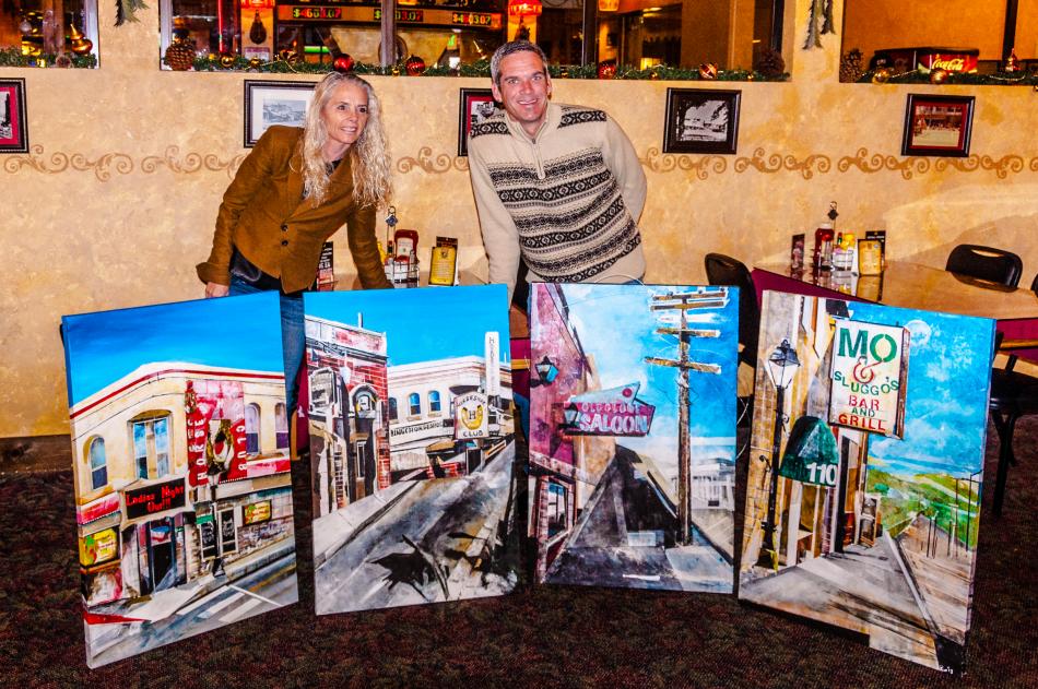 Pam Black and Jeff Pace with the paintings of the Horseshoe now and in the 1970's, the Old Globe and Mo and Sluggo's.