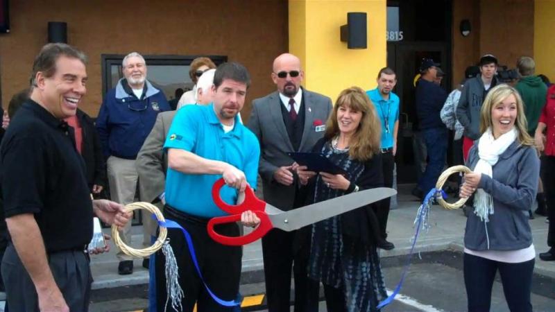 Kurtis Montgomery (Owner- far left), Ralph Baker (General Manager- ribbon cutting), and Brittany Ward (far right-VP of Marketing