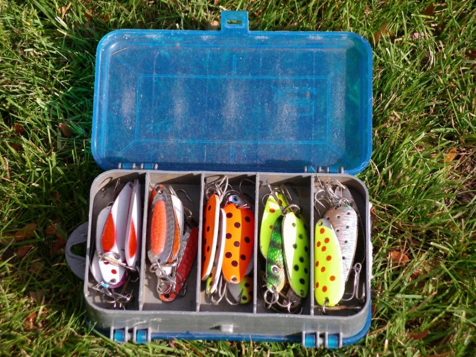 A container of various colors, types of spincasting lures. The small box is carried in a fishing vest. Photo by Elaine Quilici