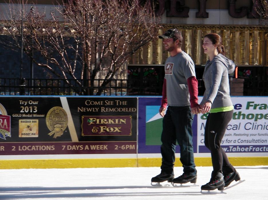 Christopher and Heather Poloway share a skate Friday in Carson City.