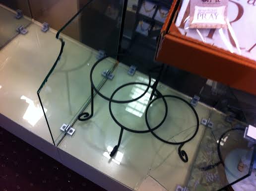 This glass fixture display case was broken in the theft.