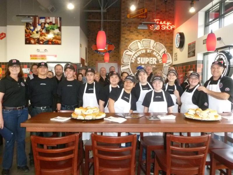 Jimmy John's and staff pose at grand opening on January 23, 2014