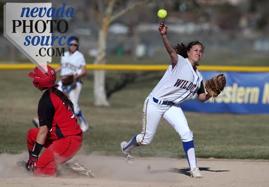 WNC's Megan Hospodka gets Colorado Northwestern Community College's Hailee Mecham out. Photo by Cathleen Allison