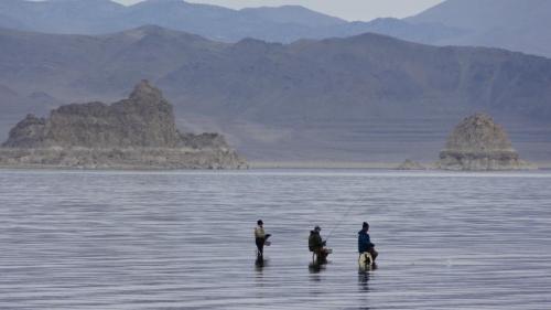 Three fishermen on their ladders at Monument Rocks at Pyramid Lake, Nevada. File Photo by Elaine Quilici