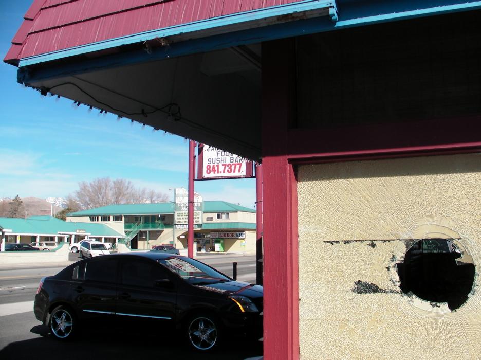 Two fireplace logs were thrown threw the windows of National's Cafe.