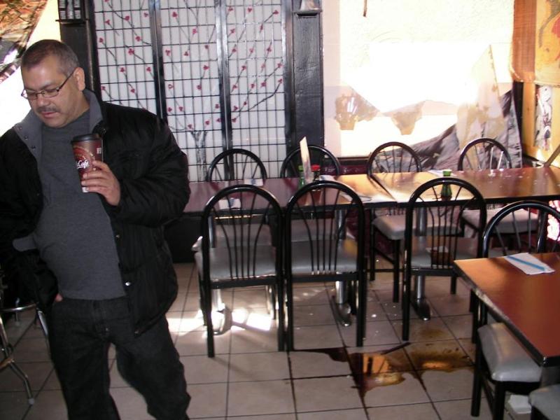 National's Cafe owner Juan Rea surveys the damage.