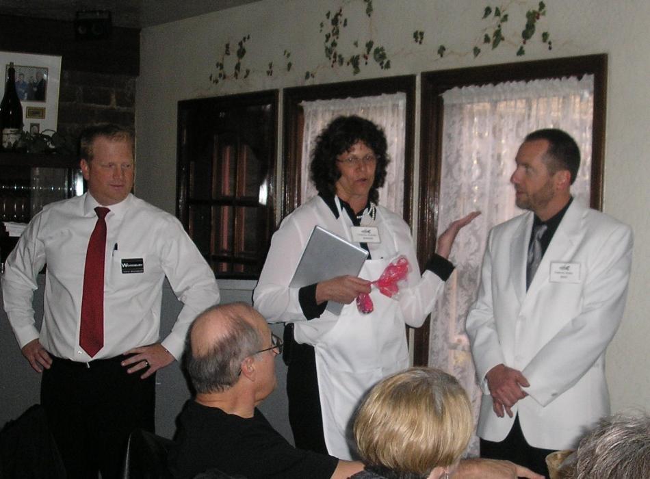 Jason Woodbury, Marena Works and Brad Bonkowski attend to guests in their role as “Celebrity Waiters” Saturday. 