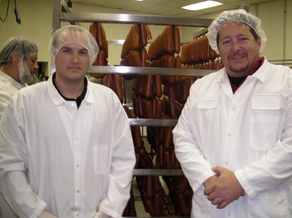 Production manager Brandon Bell and Sausage Factory President Joseph Tonino.