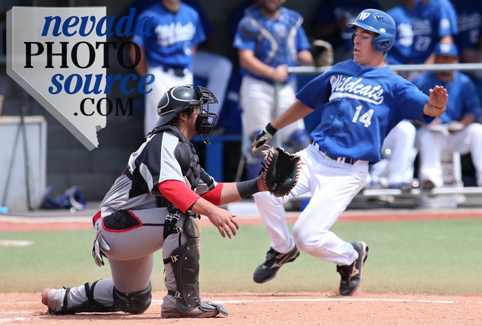 WNC's Connor Klein beats the throw to the plate against Colorado Northwestern's Jeremy Lewallen. Photo by Cathleen Allison