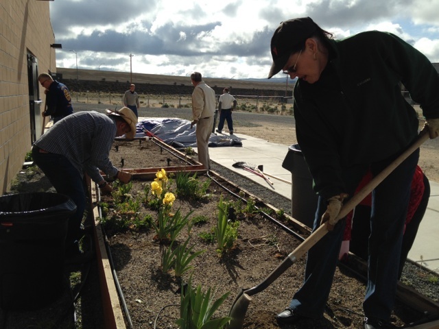 Joe Coelho and Mary Pierczynski work on flower beds at the Boys and Girls Club in Carson City.