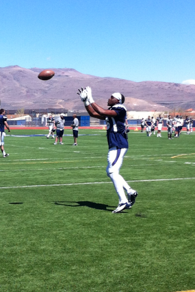Kaodi Dike, sophomore next year, goes up for a pass while warming up