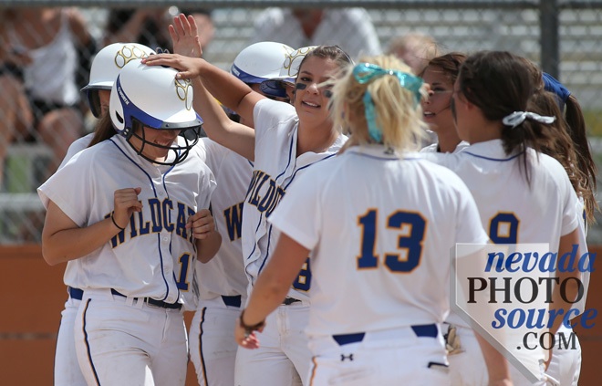 WNC's Katilyn Covione is congratulated by teammates after a two-run homer. Photo by Cathleen Allison