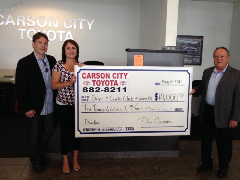 Dana Whaley (right) presents a check to Laurie Gorris and Dr. Joseph McEllistrem of the Boys & Girls Club