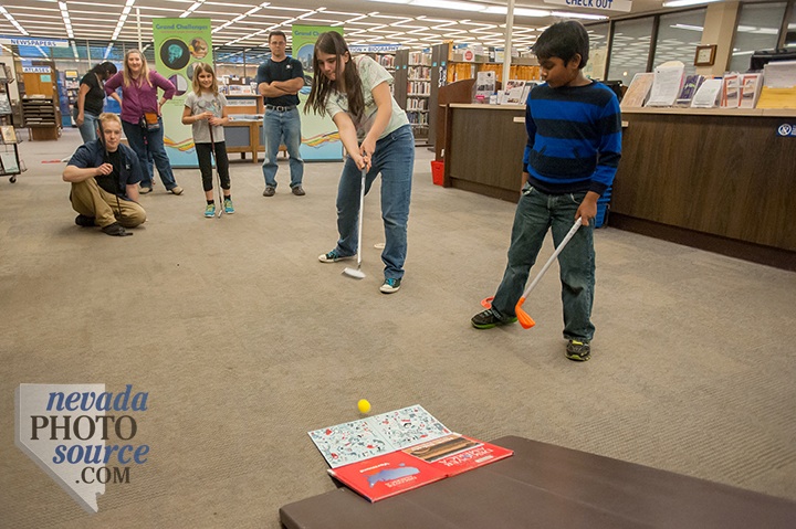 Katie Tubiello attempts a ramp shot during Mini Golf Night at the Carson City Library. Kevin Clifford, Nevada Photo Source