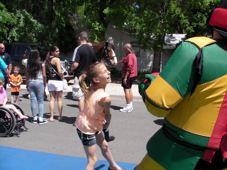 Alyssa Buttenberg, 9, follows friend Kaelyn and takes aim at the man in the suit during a self-defense exercise.