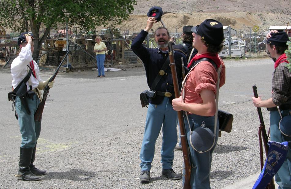 Re-enactors following a black powder demonstration on Pike Street.