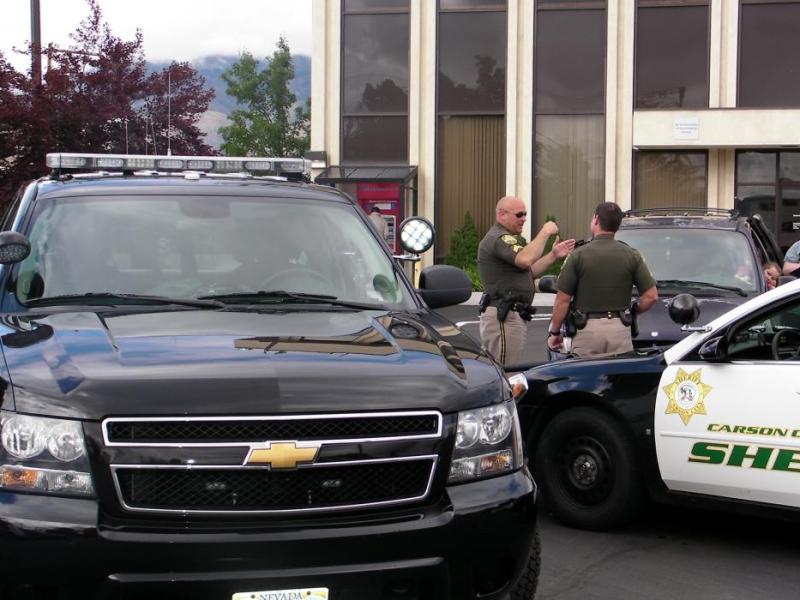 Carson City sheriff's officers at Bank of America following a robbery at an ATM machine.