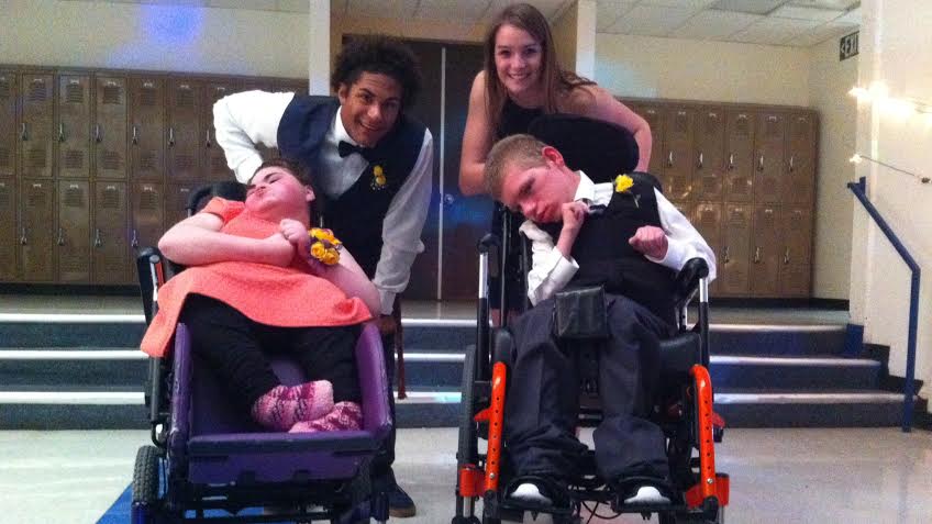 Nevin Elliot and Coryne Millet escorting their beautiful dates