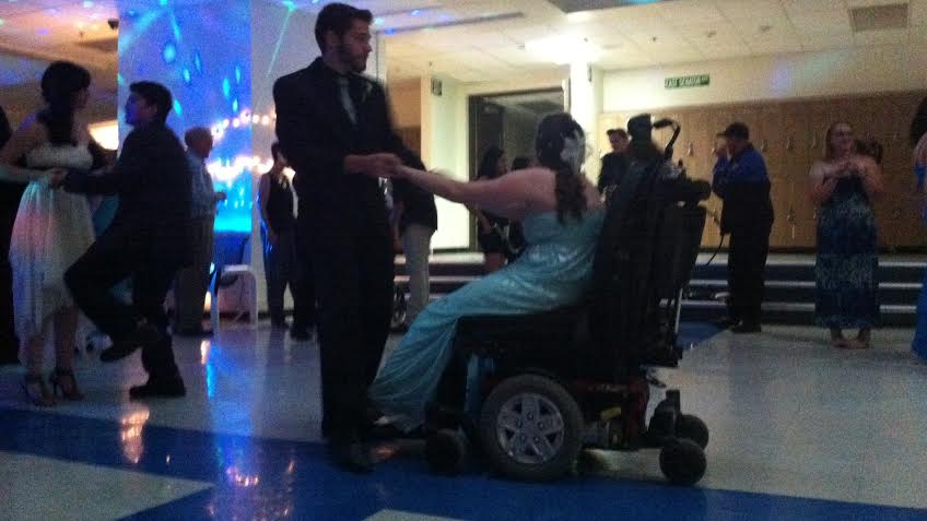 Brent Lauderbaugh dancing with his date