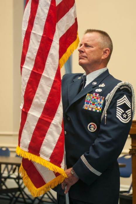 Chief Master Sgt. Greg Bartlett displays the American flag during the Nevada Guard Flag Day ceremony in Carson City on Friday.