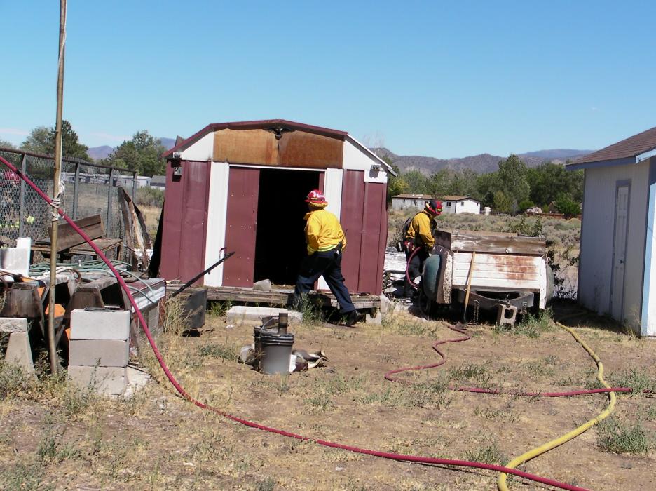 An outbuilding and some brush caught on fire Thursday afternoon on Otha Street.