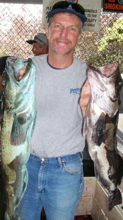Doug Busey of Douglas County with a green cod and a black cod, which were caught near Brookings, Oregon.