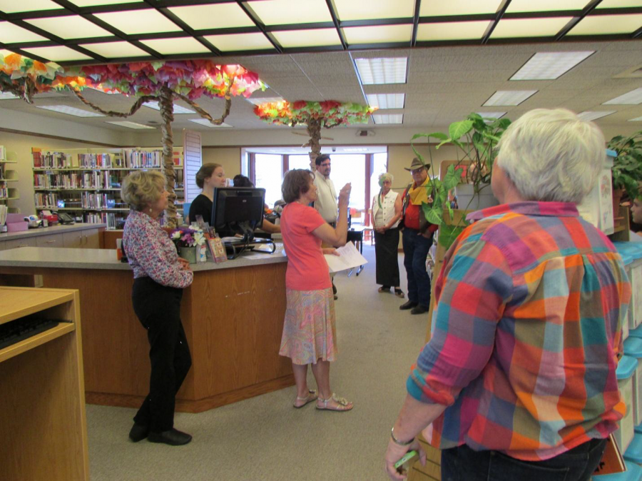 Marty Lewis, President of the Friends of the Dayton Valley Library, introducing authors
