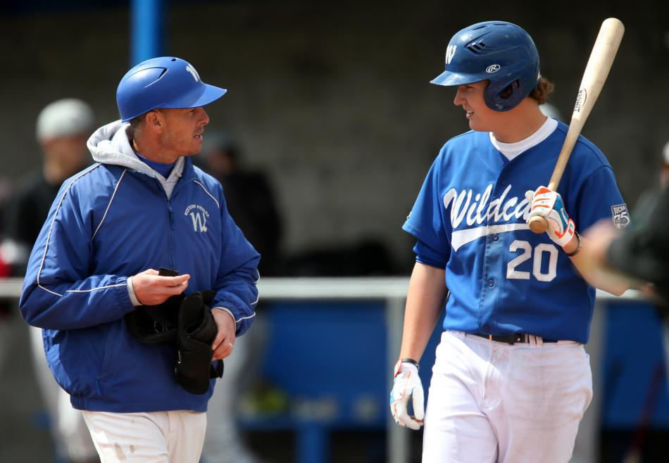 McQueen HS Grad Kody Reynolds and Head Coach DJ Whittemore.