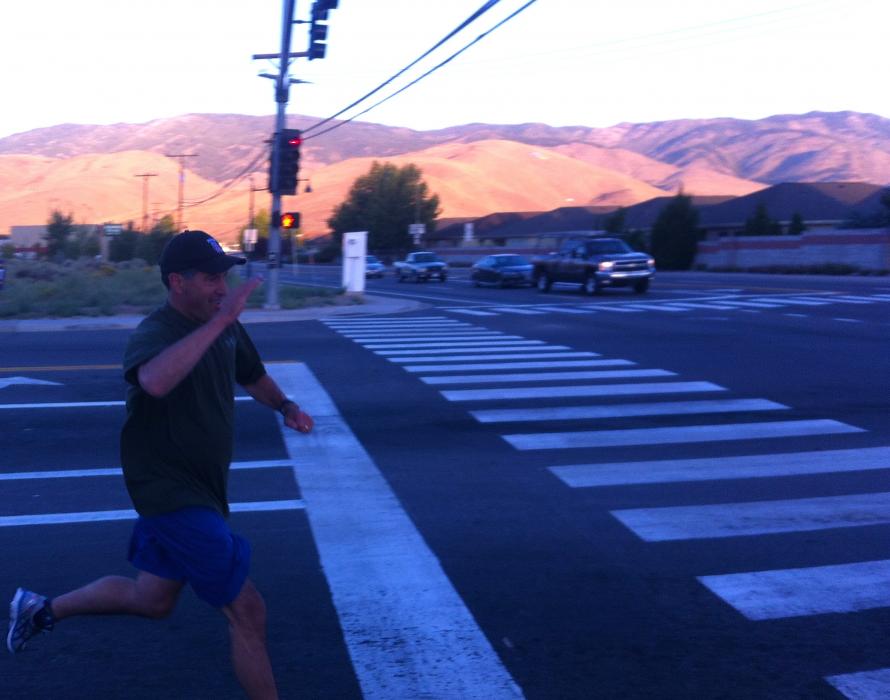 Nevada Gov. Brian Sandoval salutes while making the turn at Fairview Drive in Carson City Saturday.