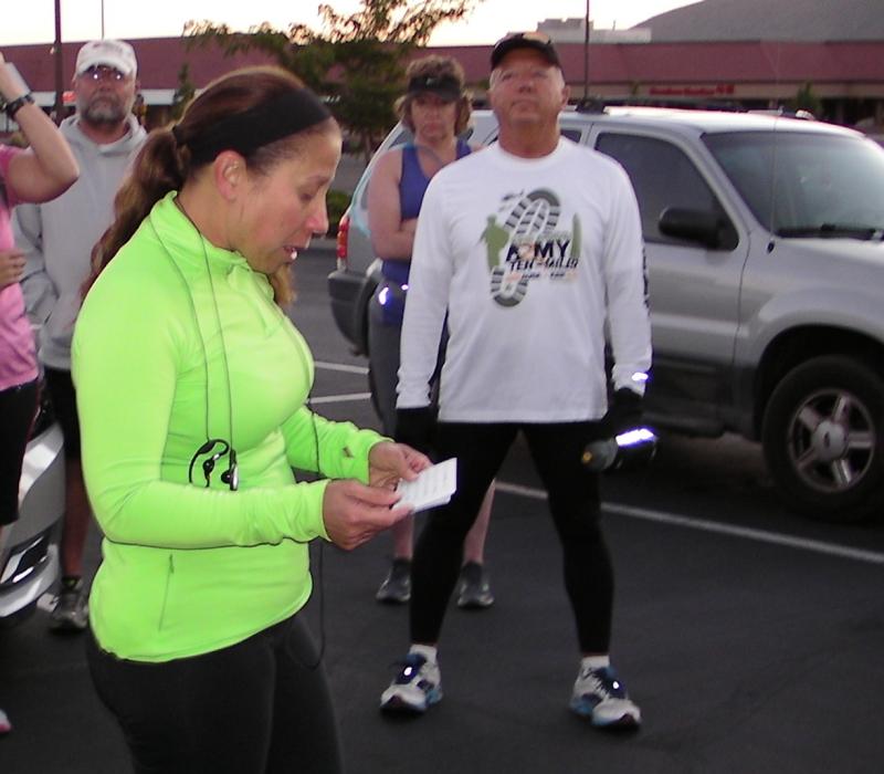 Capt. Laura Boldry leads a prayer in front of IHOP before the run.