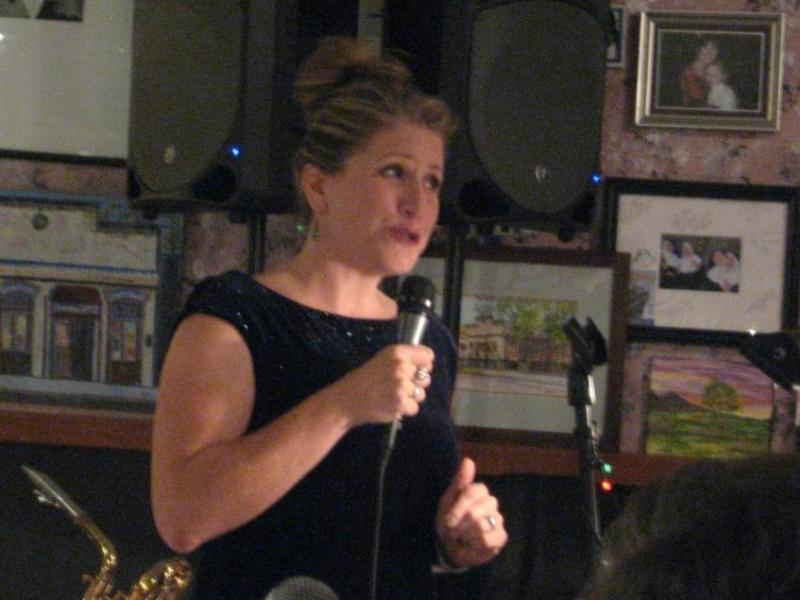 Poet Amy Roby reads at Mile High Jazz Band's Jazz & Poetry event at Comma Coffee.