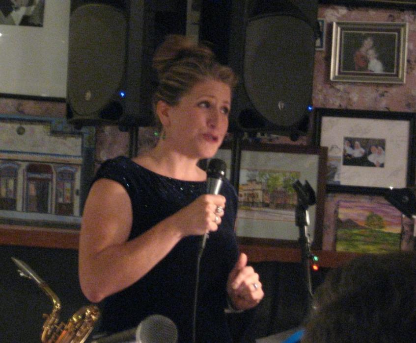 Poet Amy Roby reads at Mile High Jazz Band's Jazz & Poetry event at Comma Coffee.