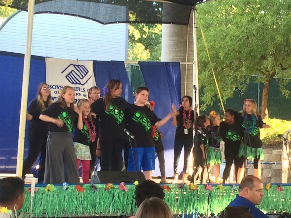 Members of the Boys and Girls Club perform a dance at the luau.