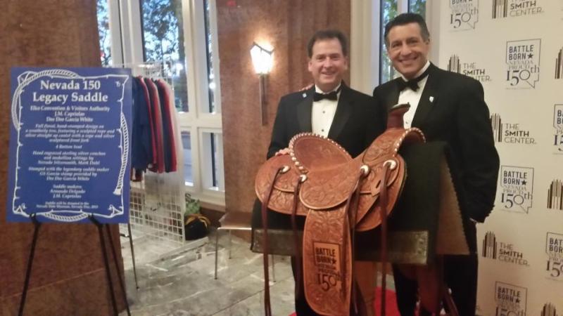 With the saddle are Lt. Gov. Brian Krolicki and Nevada Gov. Brian Sandoval