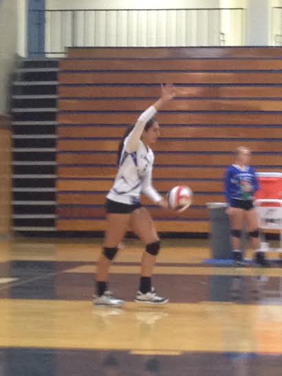 Allie Kibbe preparing for a serve.