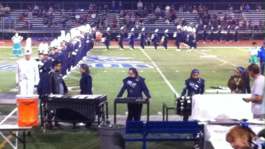 Garrett Lawson leading the band onto the feild