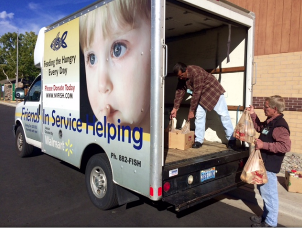FISH staff pick up food donations from the Trick or Treat school food drive. Photo by Tony Zehring
