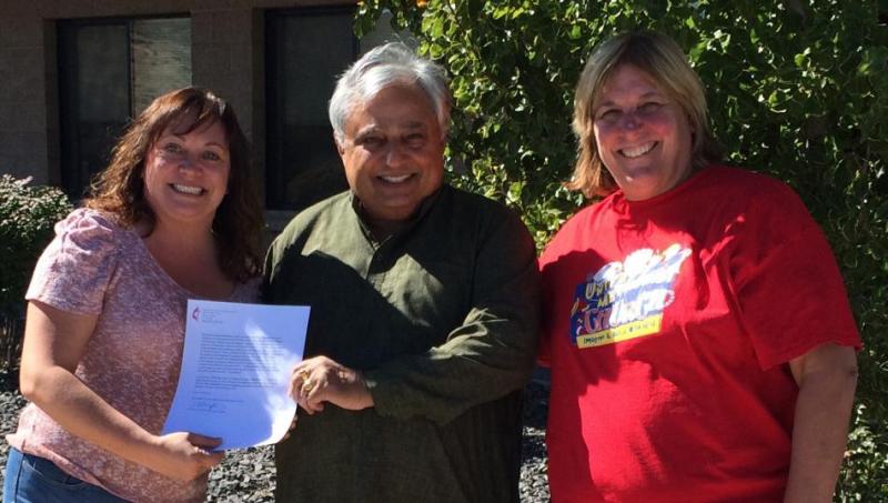 Left to right are Dawn Pidlypchak, Rajan Zed and Pastor Becky Stockdale.